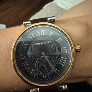 Michael Kors Rose Gold and Black Roman Numeral Wristwatch battery needed